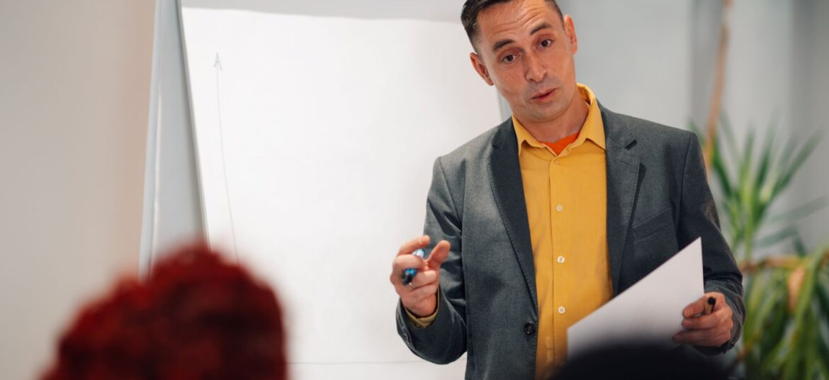 mature-man-team-leader-presenting-the-progress-of-2024-02-21-17-04-35-utc1